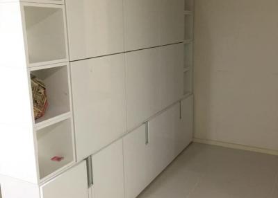 Spacious interior with large white storage cabinets