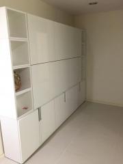 Spacious interior with large white storage cabinets