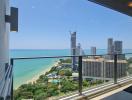 Panoramic view from the balcony showcasing the beach, sea, and cityscape