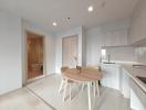 Modern kitchen with an adjoining dining area in a bright apartment