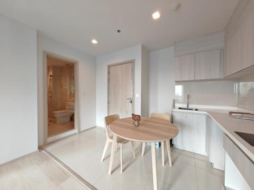 Modern kitchen with an adjoining dining area in a bright apartment