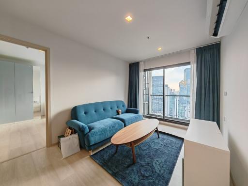 Modern living room with city view from high-rise building