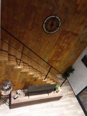 Elegant staircase with wooden steps and metal railing