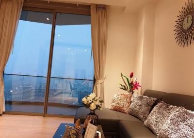 Modern living room with city view and comfortable seating