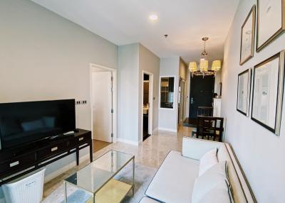 Bright and modern living room with dining area in the background