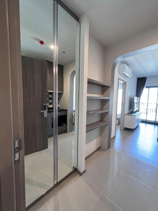 Modern entryway leading to an open concept living space