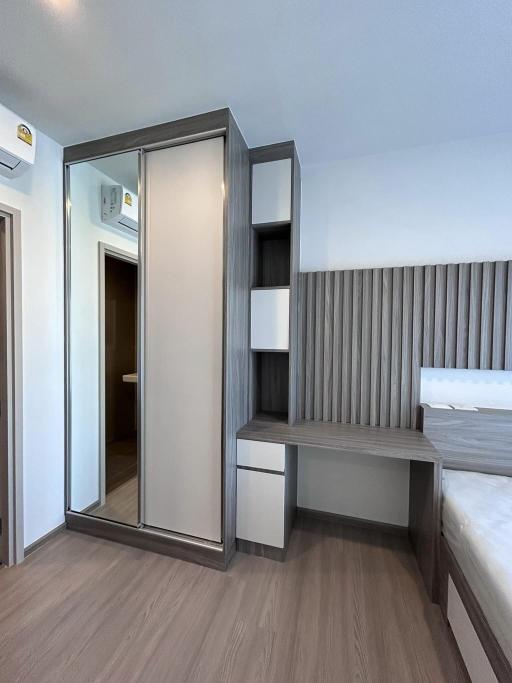 Modern Bedroom Interior with Compact Wardrobe and Bedside Table