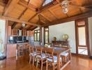 Spacious kitchen with wooden interior and dining table