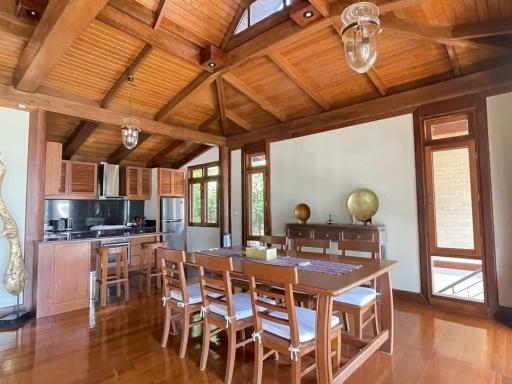 Spacious kitchen with wooden interior and dining table