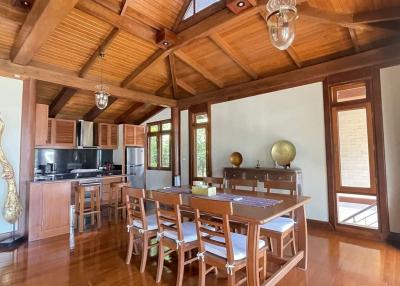 Spacious kitchen with wooden interior and dining table