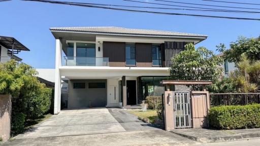 Modern two-story house with balcony and garage