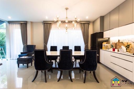 Elegant dining room with modern furniture and chandelier