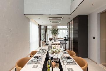 Elegant dining room with natural light and modern decor