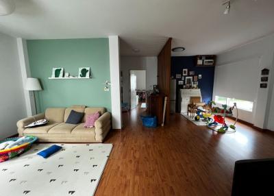 Spacious living room with hardwood floors and modern decor