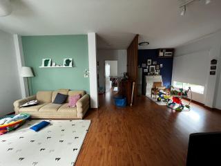 Spacious living room with hardwood floors and modern decor