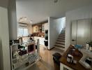 Interior of a modern home showing the kitchen and staircase leading to another level