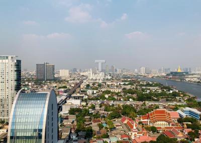 City skyline and river view from high-rise building during daytime