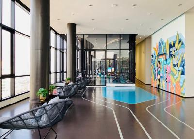 Luxurious lobby with artistic interior and swimming pool