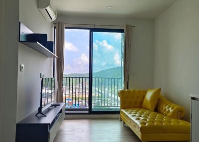 Bright and modern living room with large windows and comfortable seating