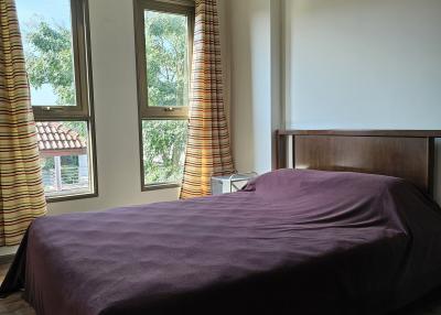 Cozy bedroom with a large bed and natural light