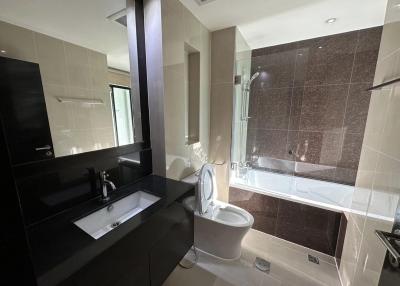 Modern bathroom with bathtub and separate shower area
