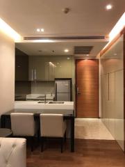 Modern kitchen with dining area and wooden finishes