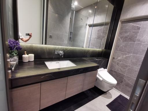 Modern bathroom interior with a shower cabin and vanity area