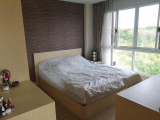 Modern bedroom with large window and natural light