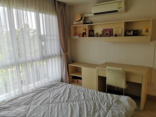 Cozy bedroom with natural light and modern amenities