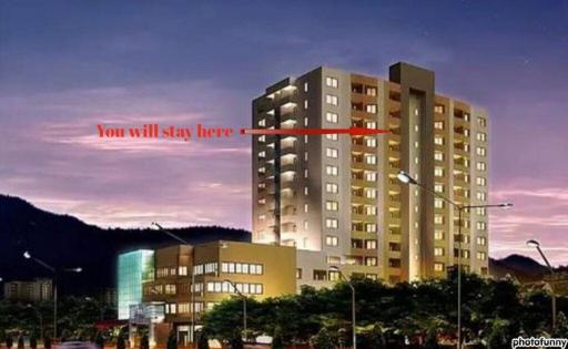 Twilight view of a modern residential building with illuminated windows