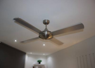Contemporary living room with modern ceiling fan and recessed lighting
