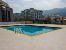 Rooftop swimming pool with city and mountain view