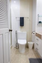 Modern bathroom interior with white ceramic fixtures