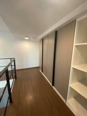 Spacious bedroom with built-in wardrobe and shelving