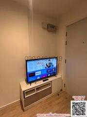 Cozy living room with wall-mounted TV and minimalist TV stand