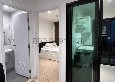 Modern bedroom with balcony access and an en suite bathroom