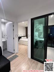 Modern bedroom with balcony access and an en suite bathroom