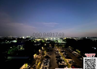 Evening skyline view from property with car parking