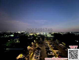 Evening skyline view from property with car parking