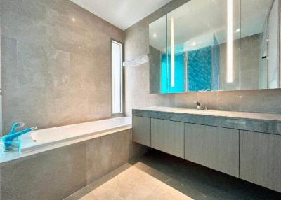 Modern bathroom with a bathtub and double vanity