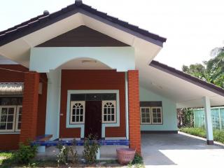 Front view of a single-storey house with a covered carport area