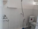 Compact bathroom with shower and toilet facilities