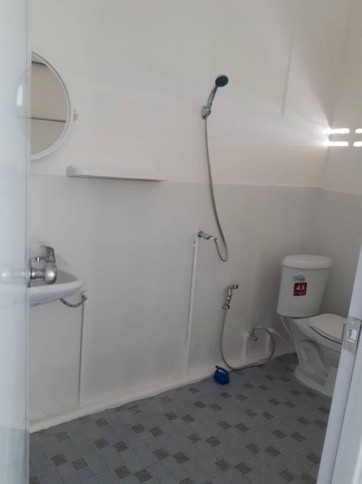 Compact bathroom with shower and toilet facilities