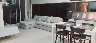 Modern living room with sectional sofa and dining area
