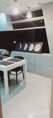 Modern dining room interior with artistic moon phase decoration on the wall