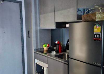 Modern kitchen with stainless steel appliances and grey cabinetry