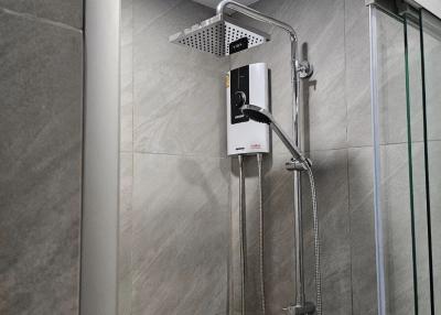 Modern bathroom with walk-in shower and wall-mounted water heater