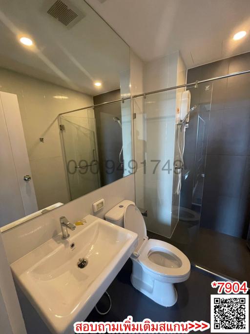 Modern bathroom interior with glass shower and white fixtures