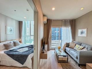 Modern bedroom with connected living space in an apartment