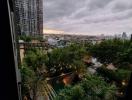 High-rise balcony view overlooking city and greenery